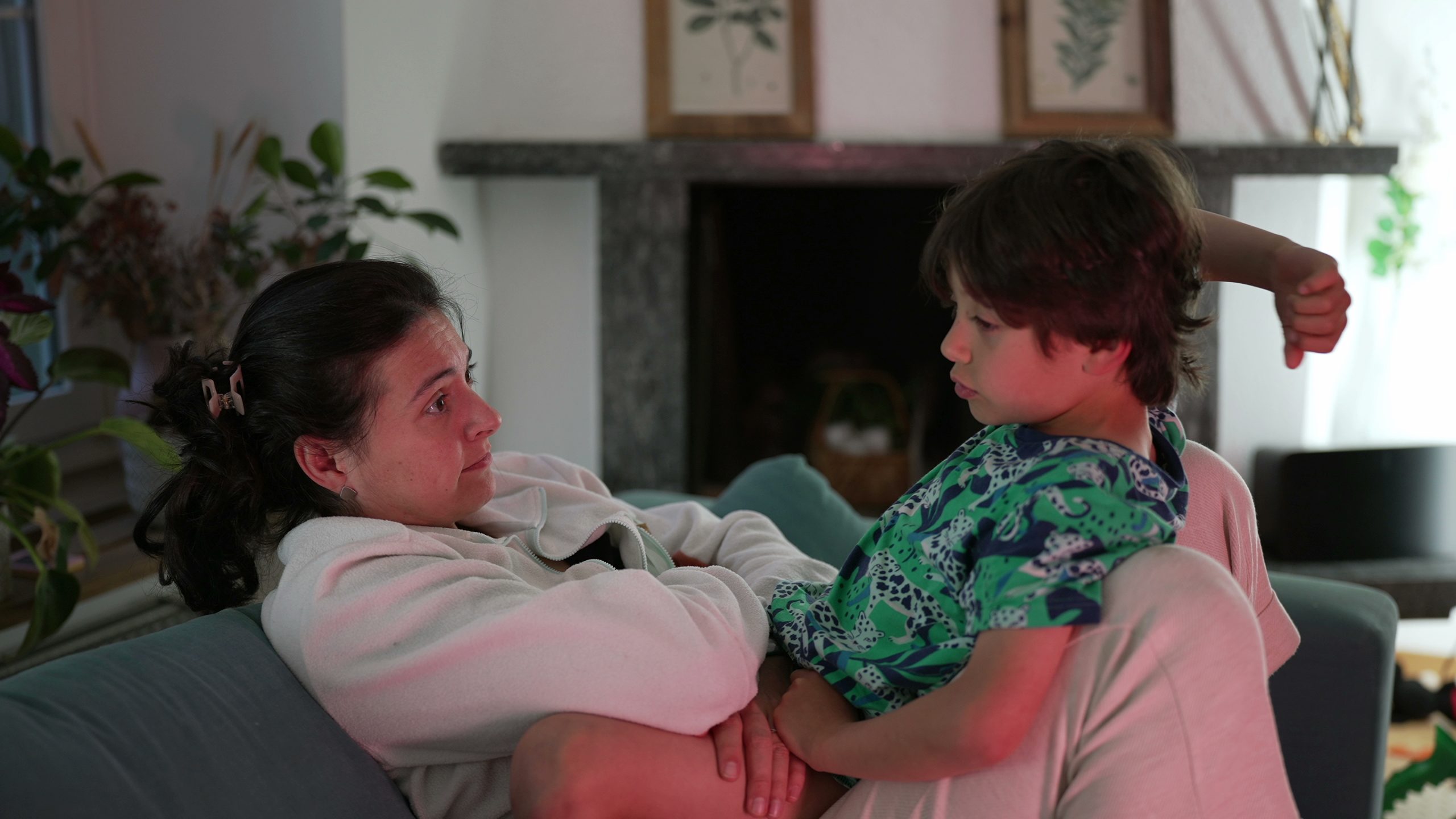 Mother sitting with her child for a calm conversation at home